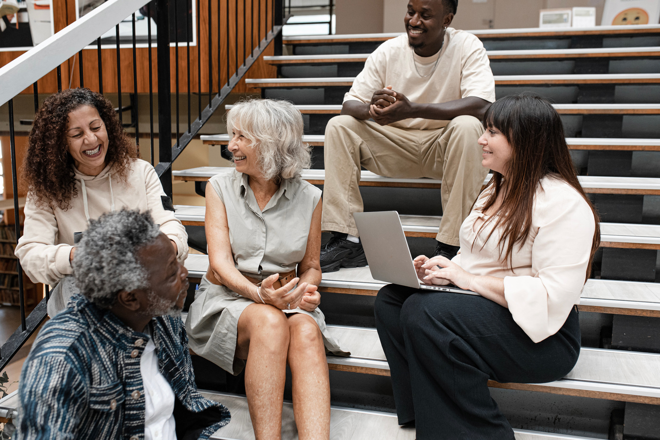 Group of Adult Students Studying in the Library 